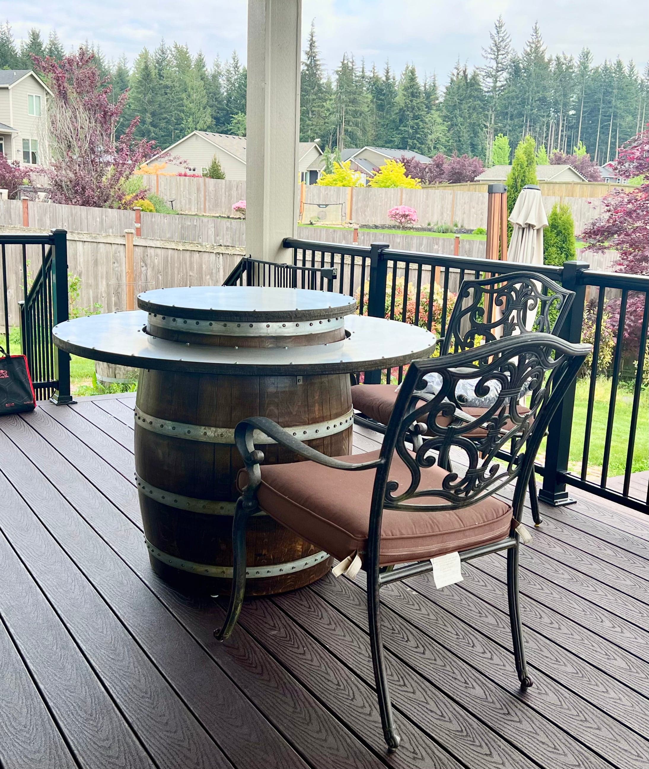 Full wine barrel table with ring top and center lid on a covered deck